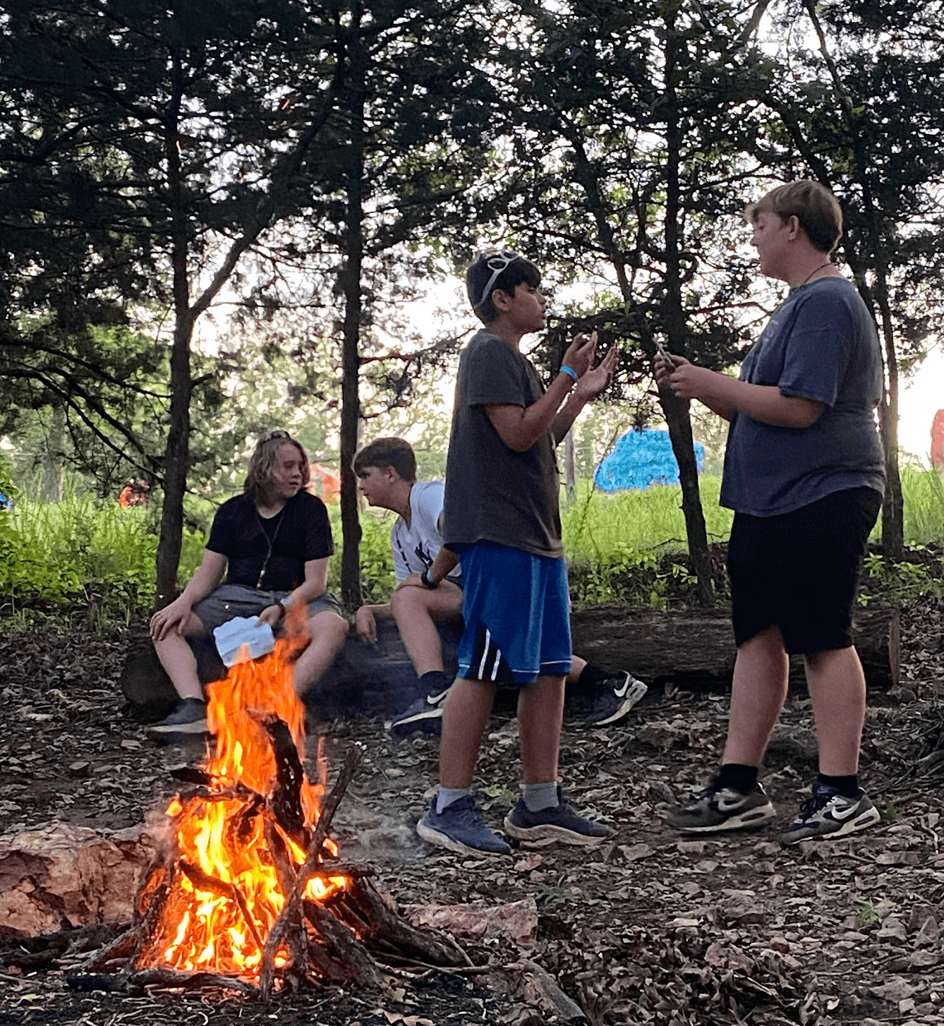 Scouts participating in a camp fire skit.